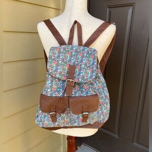 Pink and blue floral flap top drawstring mini backpack purse
